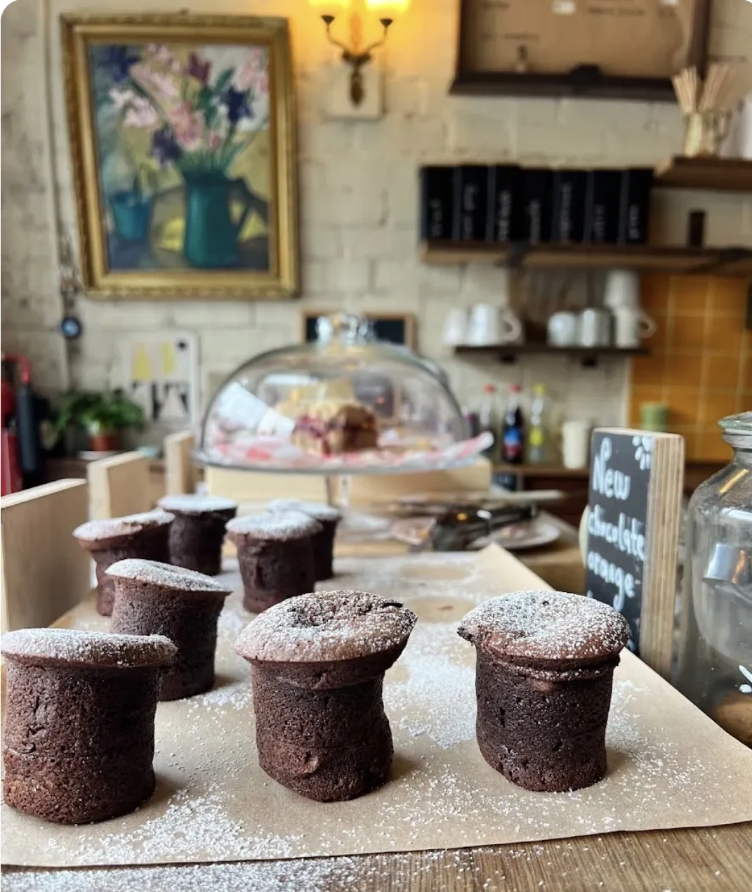 Chocolate bouchon cakes dusted with icing sugar on the Wardrobe counter