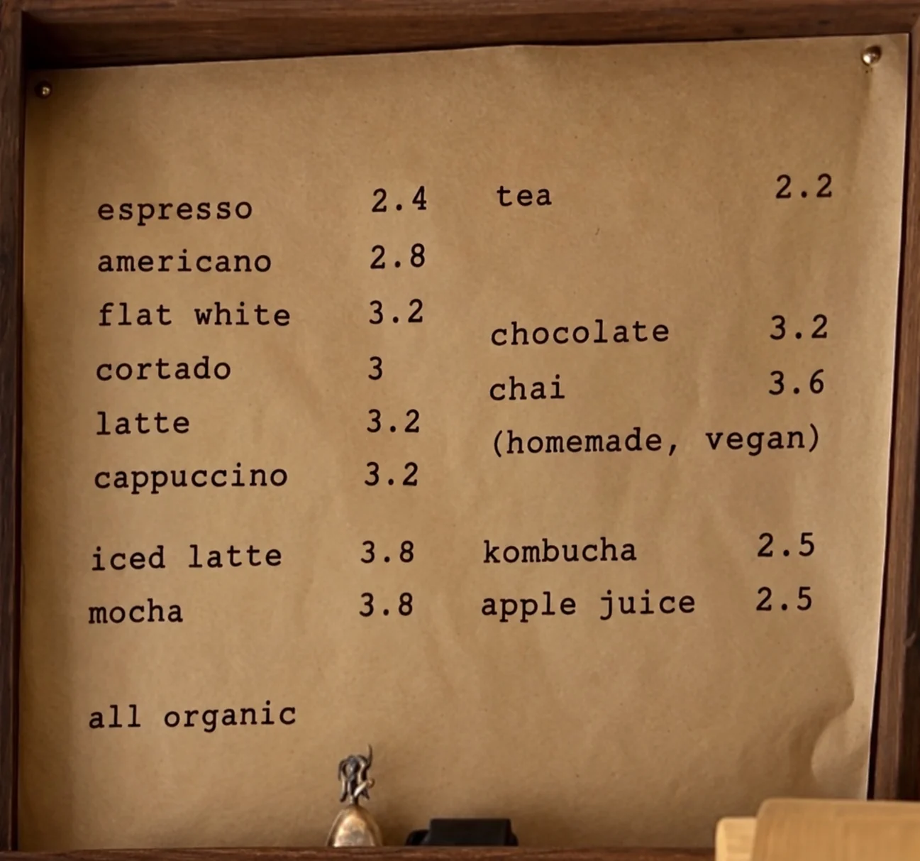 Wardrobe drinks menu board showing coffee, tea, chocolate, chai, kombucha and apple juice